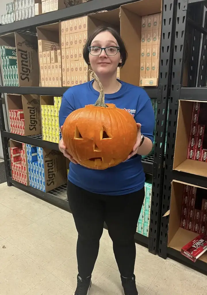 LakeSide Trading team member holding a jack-o'-lantern