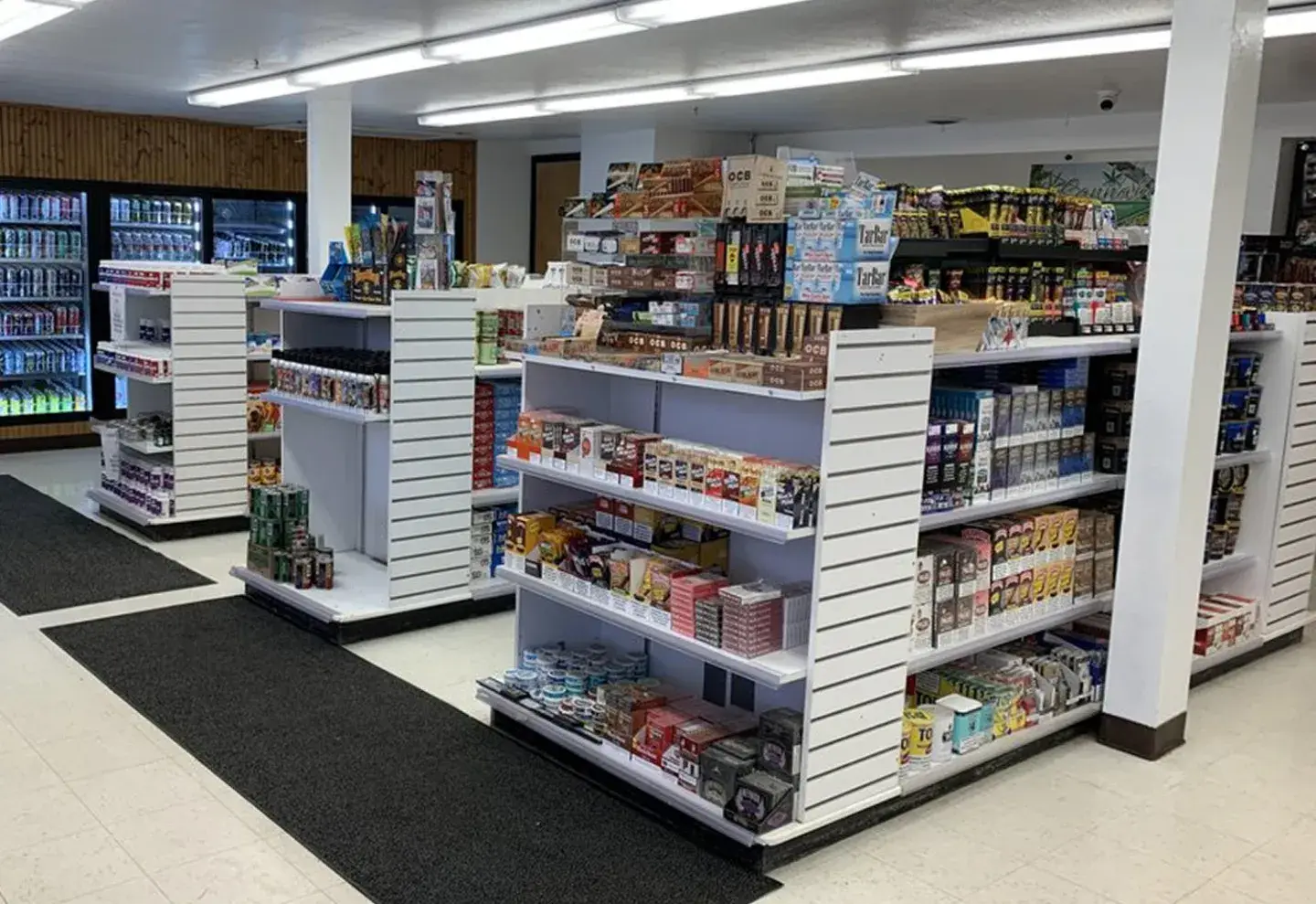 Aisles of snacks and everyday essentials inside a Lakeside Trading convenience store